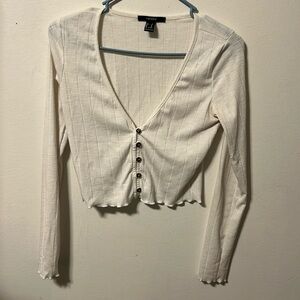 White long sleeve crop top and can button up.